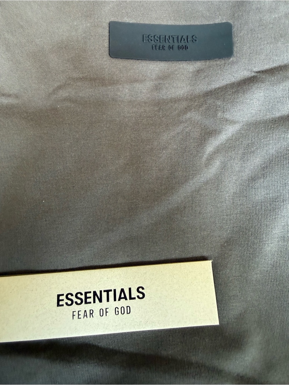 Fear of God ESSENTIALS Crewneck Tee in Olive and dark Oatmeal colors